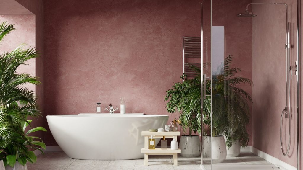 An example of classic bathroom designs with a freestanding tub and mauve walls